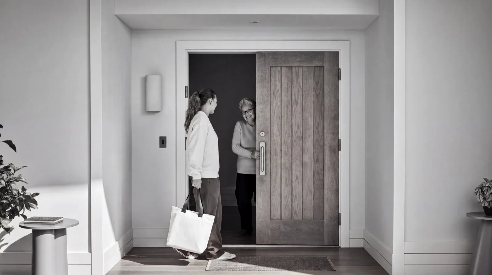 A vetted Tethr caregiver arriving at an older woman's front door